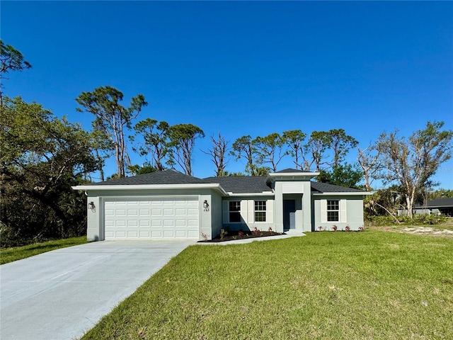 view of front of home with a front yard, an attached garage, driveway, and stucco siding