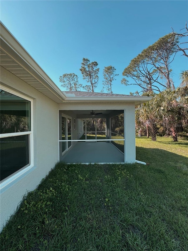 view of yard with a sunroom