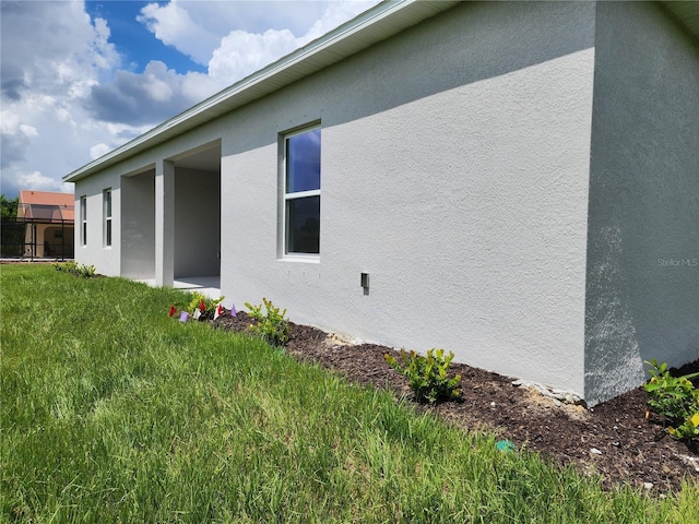 view of property exterior with stucco siding