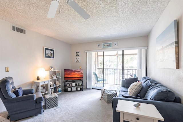 living room with light carpet, visible vents, a textured ceiling, and ceiling fan