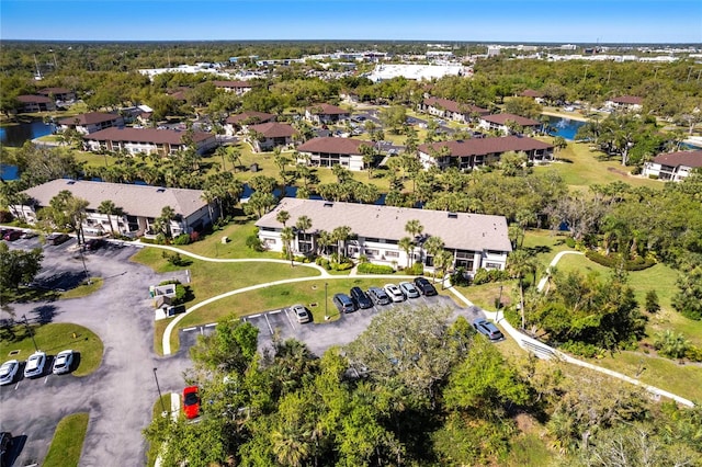 aerial view with a residential view and a water view