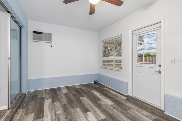 interior space with a ceiling fan, wood finished floors, and visible vents