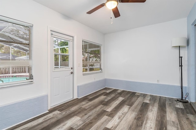 interior space featuring wood finished floors and a ceiling fan