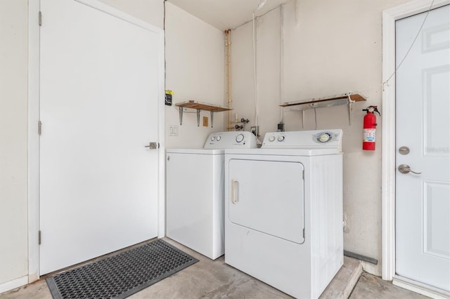 washroom featuring laundry area and separate washer and dryer