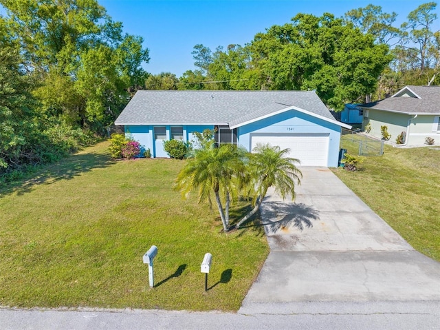 single story home featuring a front lawn, fence, roof with shingles, concrete driveway, and a garage