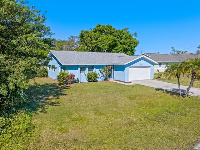 ranch-style house with a front yard, an attached garage, driveway, and stucco siding