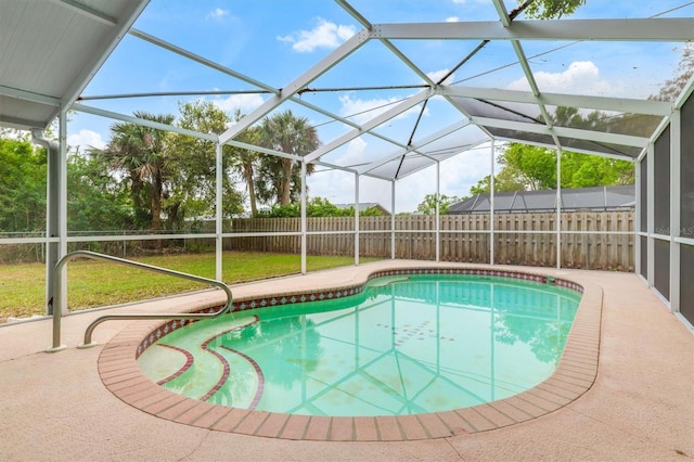 view of pool featuring a lanai, a lawn, a fenced backyard, and a fenced in pool