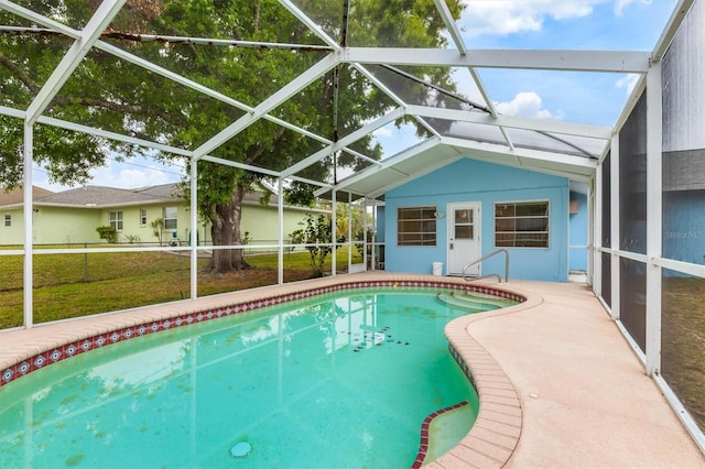 pool featuring a lawn, a lanai, and a patio area