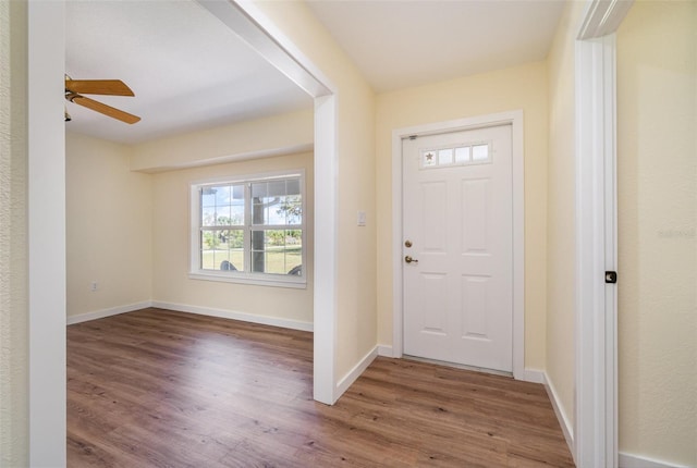 entrance foyer featuring wood finished floors, baseboards, and ceiling fan