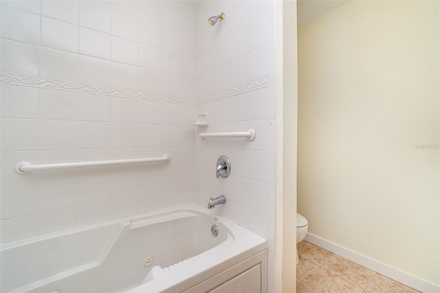 full bathroom with tile patterned floors, toilet, and baseboards