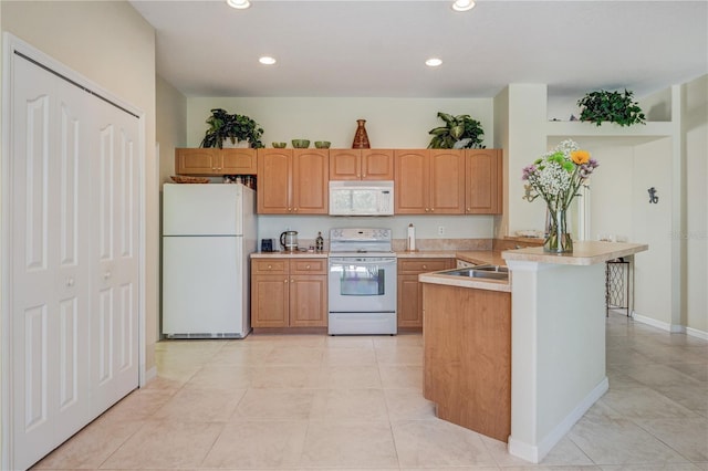 kitchen featuring light countertops, light tile patterned floors, recessed lighting, a peninsula, and white appliances