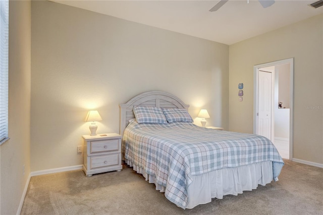 bedroom featuring a ceiling fan, visible vents, baseboards, and carpet floors