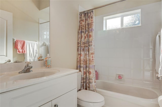 bathroom with shower / bath combination with curtain, toilet, and vanity