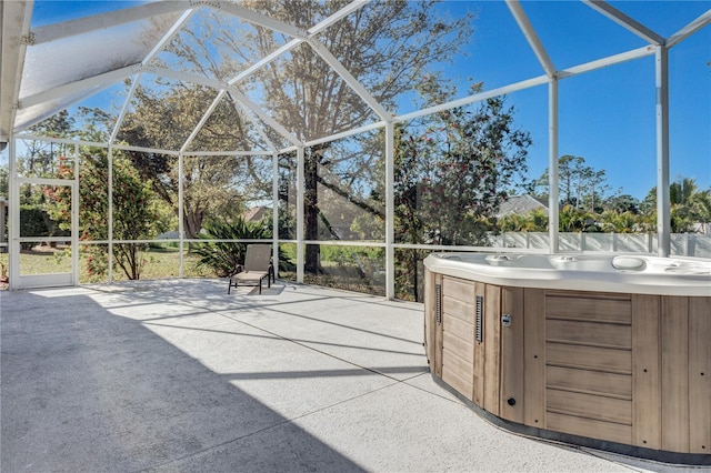 exterior space featuring a lanai and a hot tub