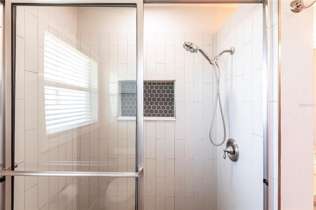 bathroom with a shower stall