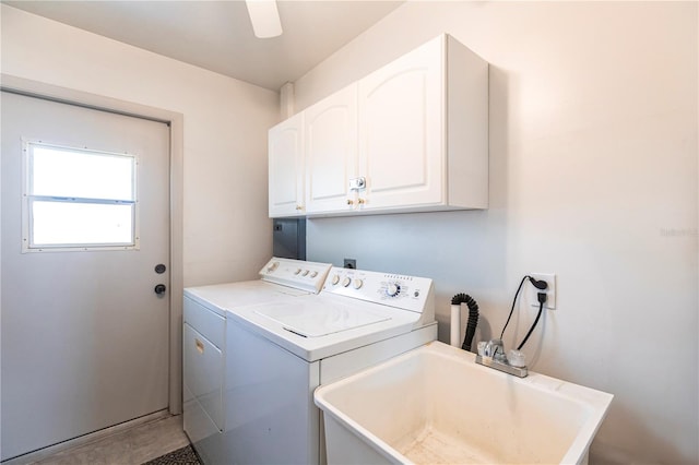 clothes washing area featuring washing machine and clothes dryer, cabinet space, ceiling fan, and a sink