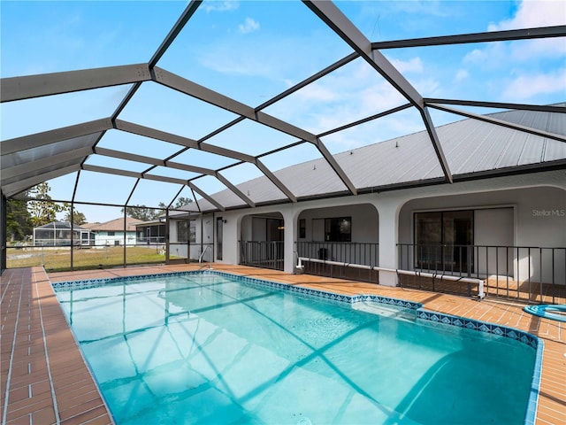 pool with a patio and a lanai