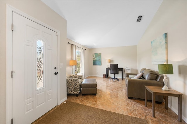 foyer featuring visible vents, baseboards, and vaulted ceiling