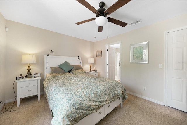 bedroom with visible vents, light carpet, baseboards, and a ceiling fan