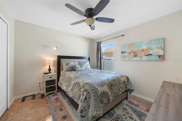 bedroom with baseboards and ceiling fan