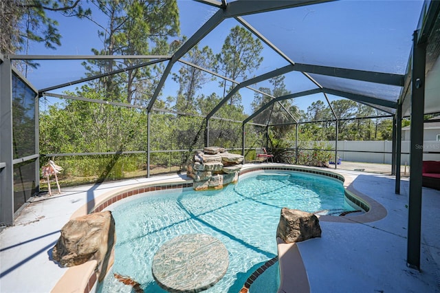 view of pool featuring a patio area, a fenced in pool, glass enclosure, and fence