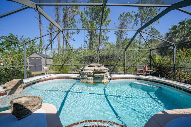 outdoor pool featuring an outbuilding, a lanai, a storage unit, and a patio