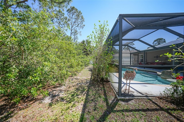 pool featuring a lanai and a patio area