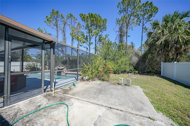 view of patio featuring a fenced in pool, a lanai, and fence