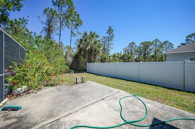 view of patio / terrace with a lanai and a fenced backyard