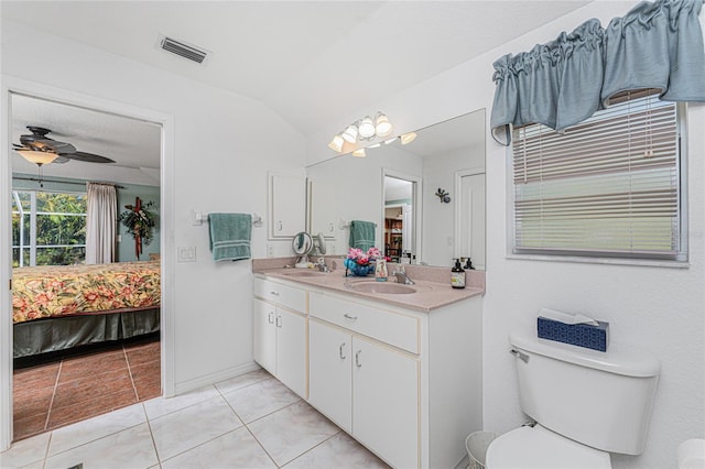 ensuite bathroom featuring a sink, double vanity, visible vents, and connected bathroom