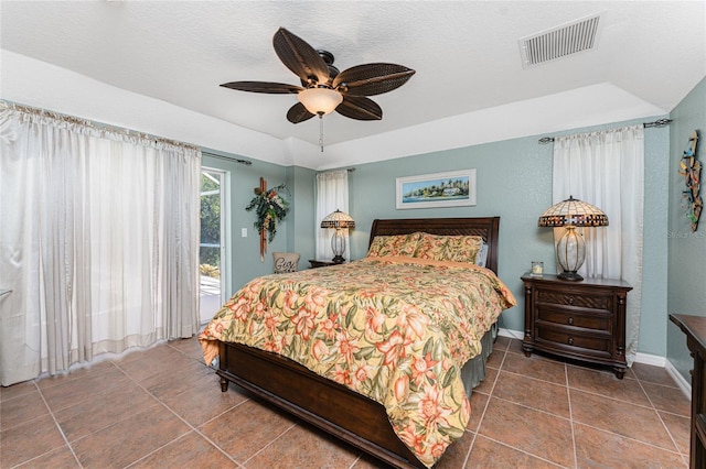 tiled bedroom featuring visible vents, baseboards, ceiling fan, and access to outside