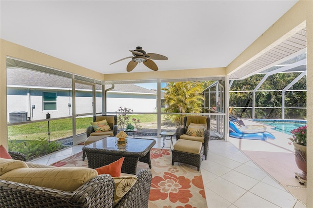 sunroom / solarium featuring ceiling fan