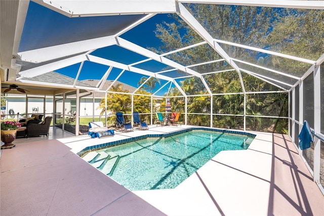 outdoor pool with a lanai and a patio