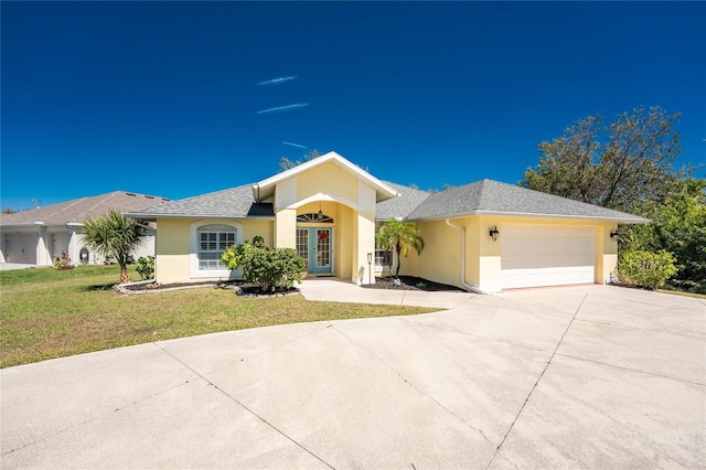 ranch-style house with stucco siding, driveway, a front lawn, french doors, and an attached garage