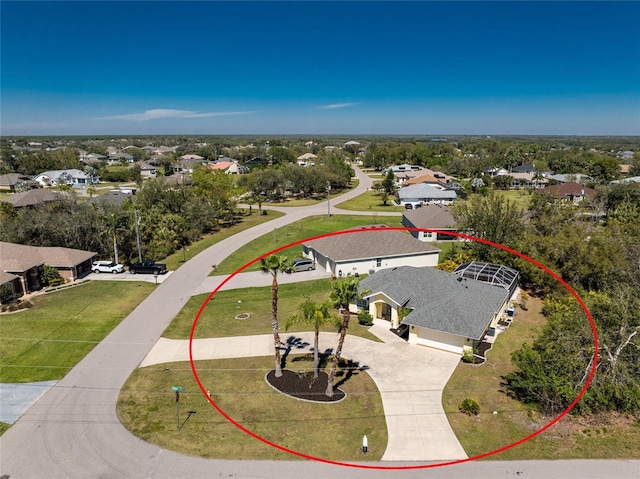 birds eye view of property with a residential view