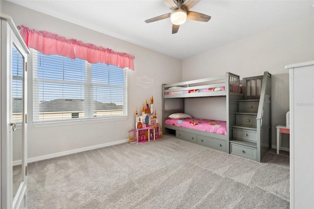 bedroom with a ceiling fan, carpet, and baseboards