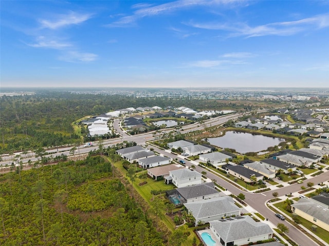 birds eye view of property featuring a water view and a residential view