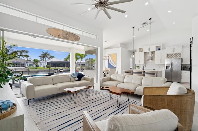 living room featuring visible vents, recessed lighting, high vaulted ceiling, and ceiling fan