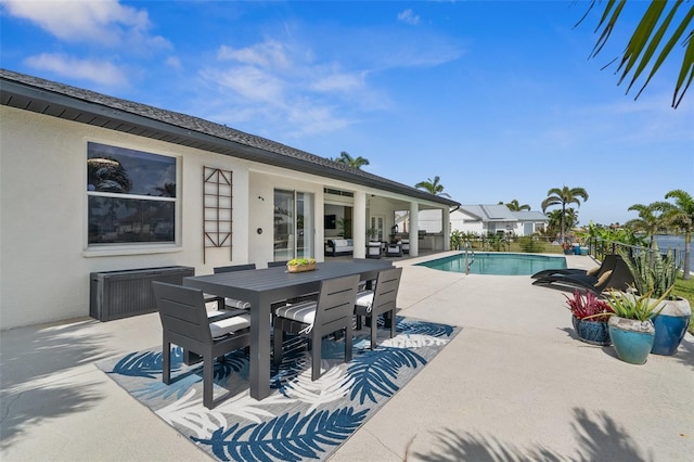 outdoor pool featuring outdoor dining space and a patio