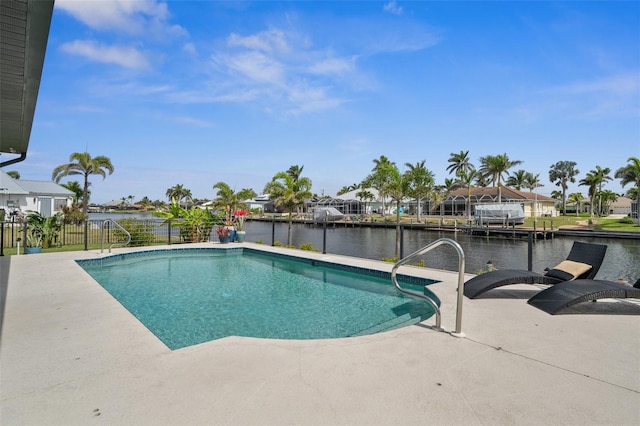 outdoor pool featuring a patio area, a residential view, fence, and a water view