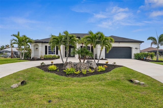 view of front of house featuring stucco siding, a front yard, an attached garage, and driveway