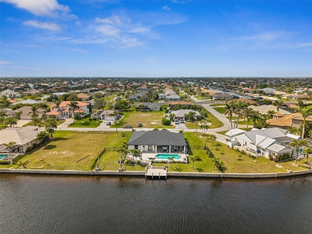 bird's eye view with a residential view and a water view