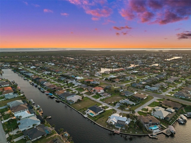 aerial view featuring a residential view and a water view