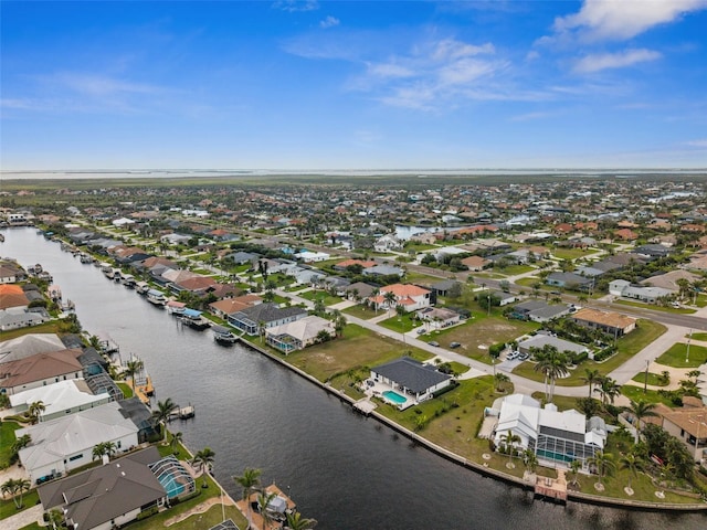 aerial view with a residential view and a water view