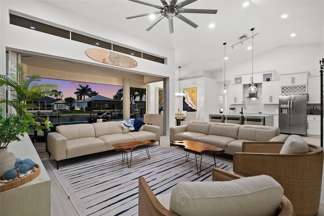 living area featuring visible vents, recessed lighting, high vaulted ceiling, and ceiling fan