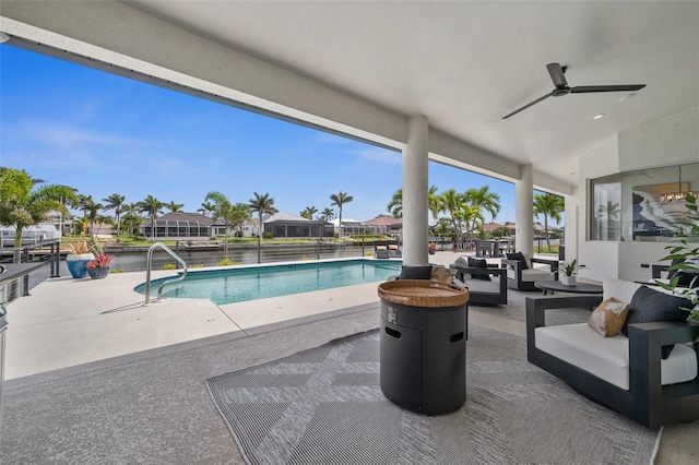 view of swimming pool with a fenced in pool, a patio, ceiling fan, and outdoor lounge area