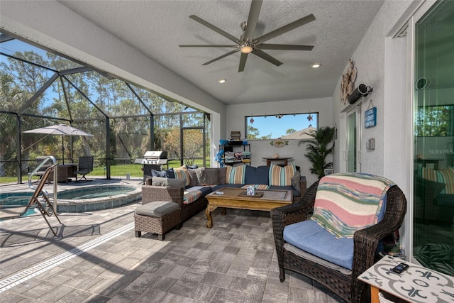 view of patio with an outdoor living space, an in ground hot tub, glass enclosure, and ceiling fan