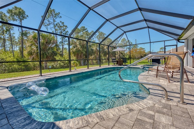 outdoor pool featuring glass enclosure and a patio