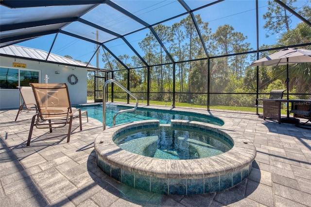 view of swimming pool with a patio, a lanai, and a pool with connected hot tub