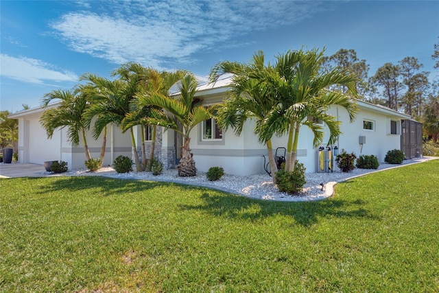 view of home's exterior featuring concrete driveway, an attached garage, a lawn, and stucco siding